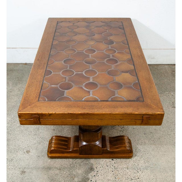 Unique and extremely well made solid oak French brutalist coffee table with tile top surface. Very well made throughout...