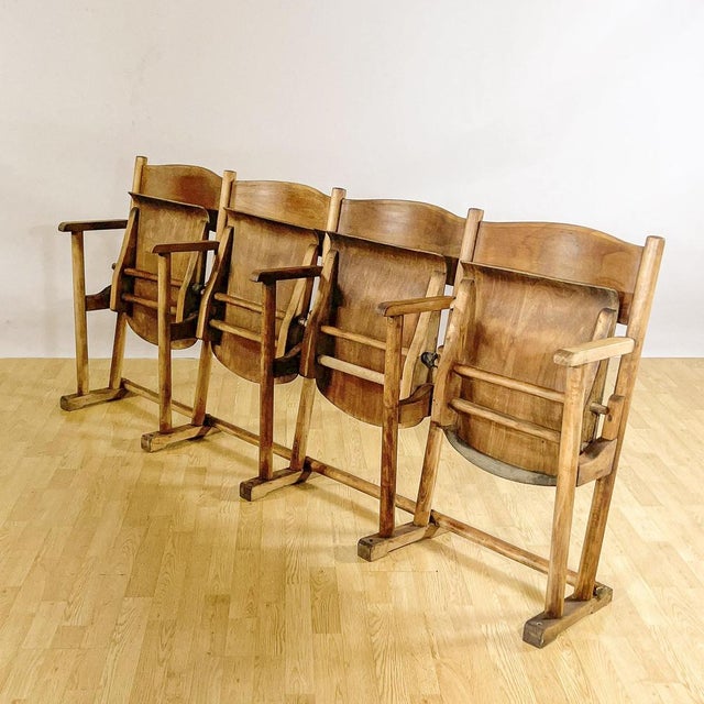 This four-seat cinema or theater bench evokes the cultural atmosphere of the 1950s, presenting itself as an original...
