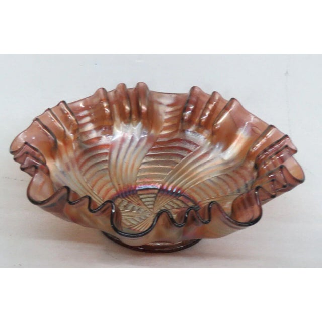 This wonderful bowl is made of carnival glass. This bowl features the Ribbon Tie pattern used by Fenton; it has a stunning...