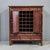 Large unusual antique four door red lacquered cabinet from China. The interior has been fitted with a 24 bottle wine rack...