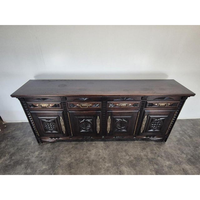 Breton Sideboard with Four Doors in Carved Oak and Brass, in Very Good conditions.