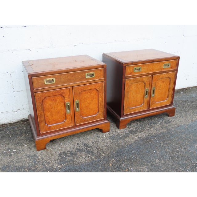 This Pair of Nightstands is made of wood, solid wood, burlwood, veneer, and metal. The Nightstands were made by Century...