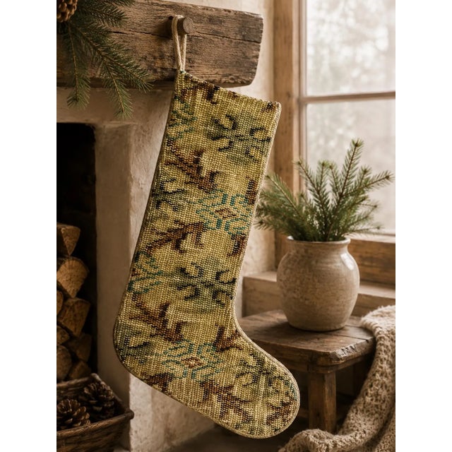 Hand-cut from a genuine vintage wool kilim, this one-of-a-kind Christmas stocking features a soft sage green and olive...