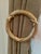 These brass drapery tie backs are in the shape of a wreath with the ribbon and reed design. Hollywood Regency? Colonial...