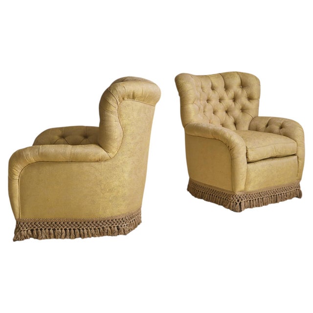 A 20th century Italian tufted club chair in a radiant shade of yellow. This chair was sourced directly from a Modernist...
