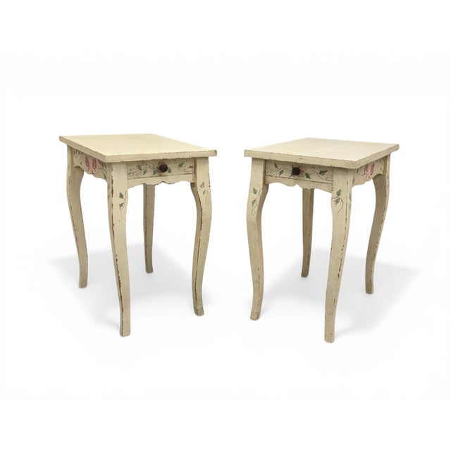 A lovely pair of vintage French Country hand-painted side tables or nightstands. Made in Italy by Buying & Design (B&D) of...
