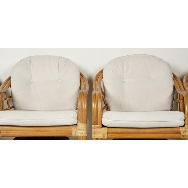 Hollywood Regency Set of Four Vintage Coastal Rattan Swivel Lounge Chairs on Casters With Original Cushions For Sale - Image 3 of 7