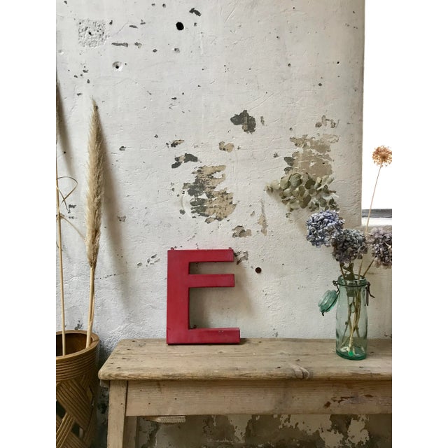 This old industrial letter E in metal was produced around 1950.
