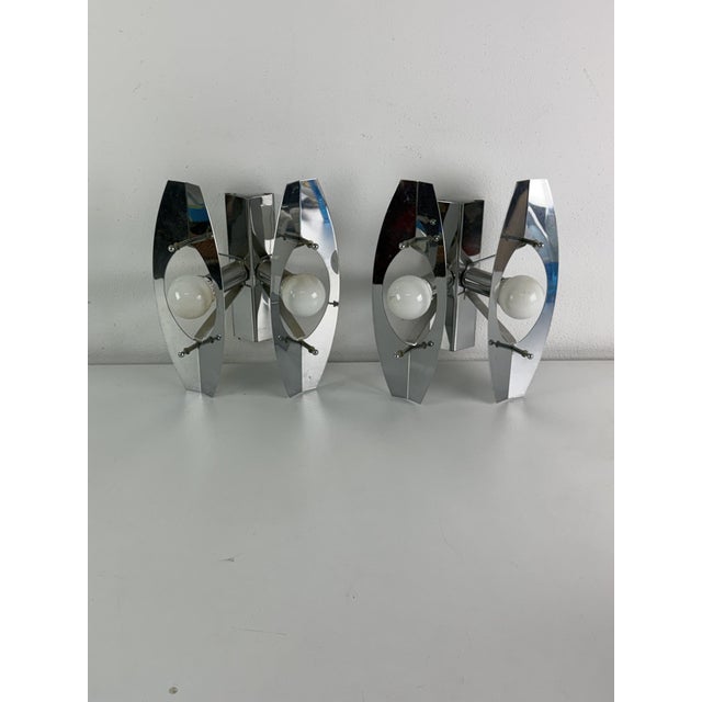 Set of two Space Age wall lamps in the style of Oscar Torlasco, 1960s Chrome-plated metal, E14 bulbs. Good condition. This...