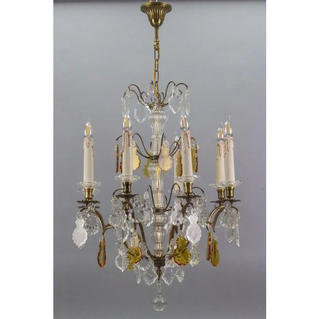 - A stunning Louis XVI style chandelier; - Originally crafted for 8 candles, this antique chandelier has been electrified....