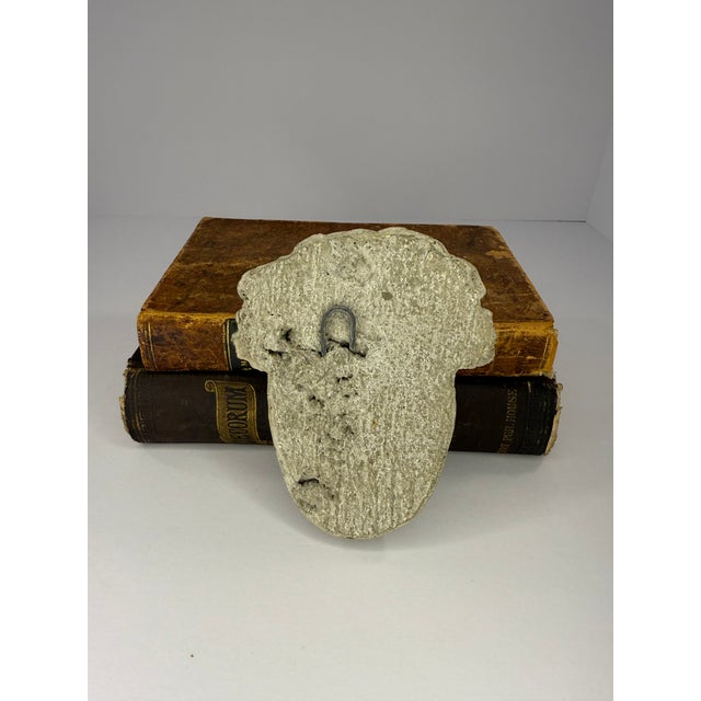 Reproduction of a classic Greco-roman garden plaque featuring a male face. Distressed weathered appearance, appropriate...