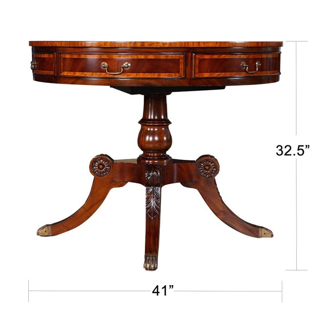 Our most robust drum table this large Round Center Table has eye catching appeal with satin wood banding, carved knees and...