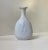 A blanc de chine vase design by swedish ceramist gunnar nylund for hellerupis (hellerup ice cream) in denmark. The front...