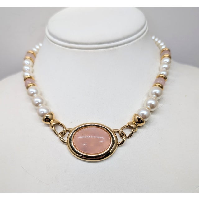 Goldtone cabochon rose quartz center with beaded faux-pearls and rose quartz beads necklace with fold over clasp. Marked...