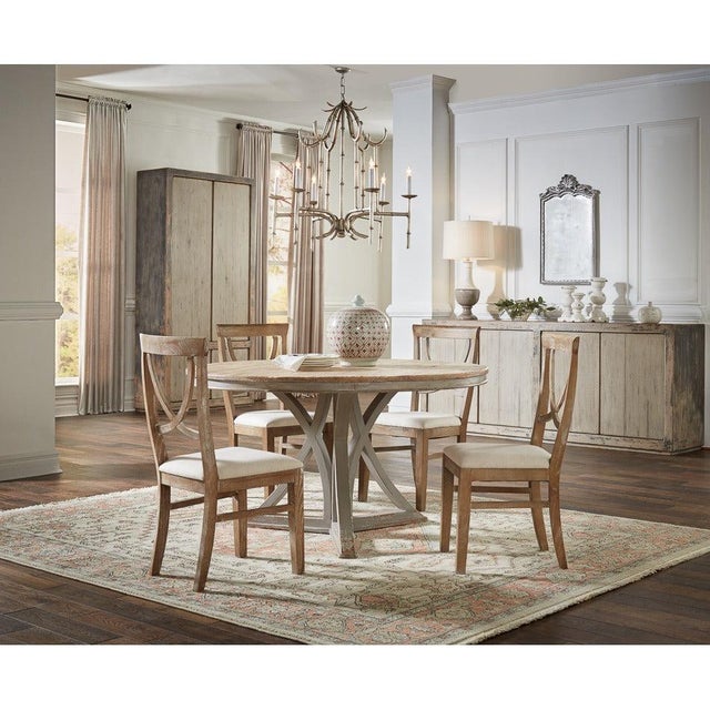 Softly contrasting gray tones give the broad pine case a relaxed, weathered presence. Four vertically planked doors run...