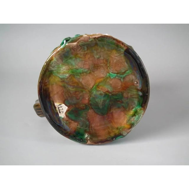 George Jones Majolica jug/pitcher which features pink and white blossom (hawthorn or mayflower), and green leaves on...