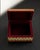 A compact wooden jewelry box with a hand-painted garden composition of birds and flowers on a turquoise ground. Geometric...