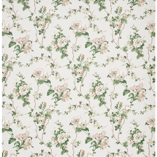 A lush tangle of tulips, roses and ranunculi climbs a trellis of branches in this gorgeous wallpaper design. Since...