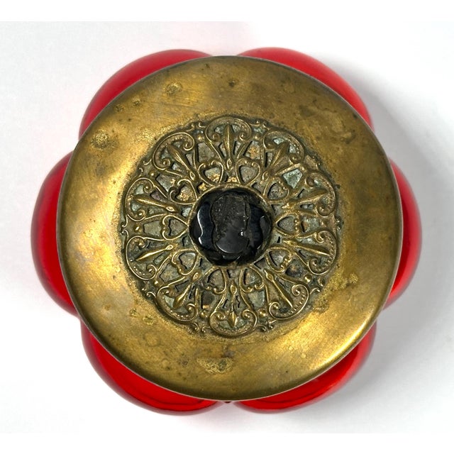 Antique Ruby Glass Bonbonniere with Cameo Mounted Filigree Brass Lid for your consideration. The jar measures approx. 3...