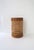 A woven wicker cane and glass hurricane candle table lamp, circa late-20th century. A woven cane and wicker hurricane...