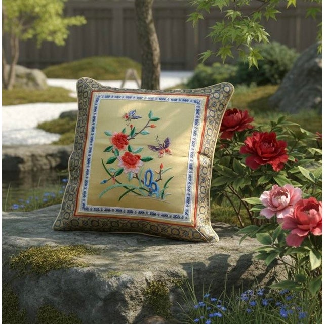 Finely crafted Chinese silk pillow featuring hand embroidery of peonies and butterflies, traditional symbols of beauty,...