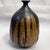 For your consideration, a mid-century modern sculptural pottery vase with earth tones. Signed at the bottom, unable to...