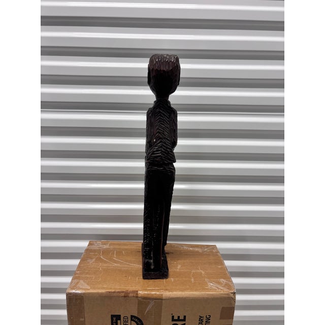 African Vintage Hand-Carved Wooden African Tribal Figurine Depicting a Man Playing a Drum, Crafted From Dense Hardwoods Like Ebony For Sale - Image 3 of 12