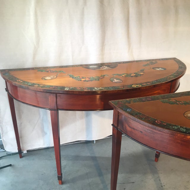 Pair of demi-lune side tables. Adam style. Hand-painted with beautiful detail. Made of satinwood . Large scale: 34”...