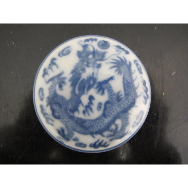 Chinese red seal ink pad, traditionally used for calligraphy and stamping seals. It consists of a red, oil-based cinnabar...