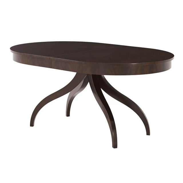 With a mocha finish Mahogany Veneer on brass castors with one self-storing extensions leaf. One Self-Storing Extension...