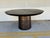 Stylish Uttermost Madrone Outdoor / Indoor Metal Dining Table. Sculptural cylindrical pedestal base, textured dark bronze...