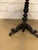 This is an lovely Black Forest antique side table! The rich ebony colors of the wood base blend together with the warm...