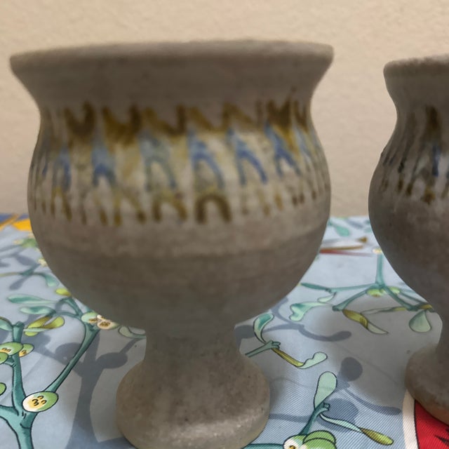 Carefully hand-thrown from robust stoneware clay, each chalice features a rustic, textured beige and gray speckled body....
