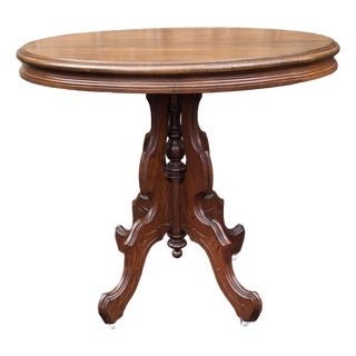 Late 19th Century Victorian Rococo Style Carved Walnut Oval Rolling Side Table For Sale