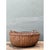 This vintage Shaker-style rattan basket presents a generous, gently rounded silhouette with a broad, shallow bowl that...