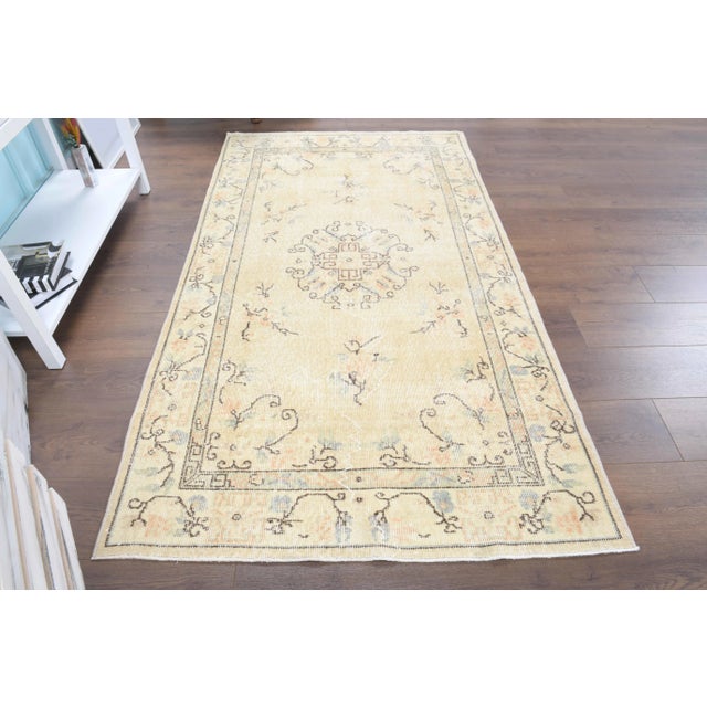 Vintage Turkish Hand-Knotted vintage rug is a semi-antique vintage area rug.'70s Eastern region of Turkey's unique rug is...