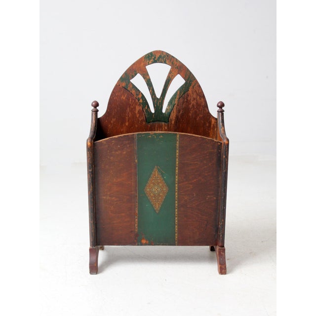 This is an antique Art Nouveau wooden magazine holder, circa late 1800s. It features graceful, stylized cut-outs and...