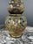 Pair of Satsuma ceramic vases, richly decorated with figures in traditional costumes, as well as numerous symbolic motifs...