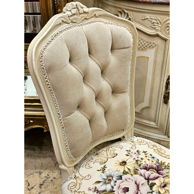Add a refined French-inspired touch to your interior with this beautiful off-white upholstered accent chair, featuring a...