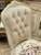 Add a refined French-inspired touch to your interior with this beautiful off-white upholstered accent chair, featuring a...