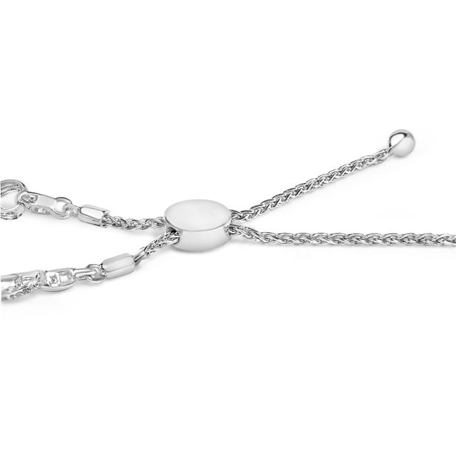 Crafted from radiant .925 sterling silver and finished with sleek rhodium plating, this bracelet intertwines endless...