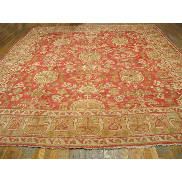Antique Oushak rug. Measures: 12'2" x 14'8".
