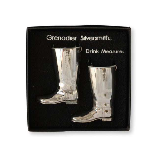 Late 20th-century Grenadier Silversmiths barware set, featuring a pair of silver-plated jiggers in the shape of riding...