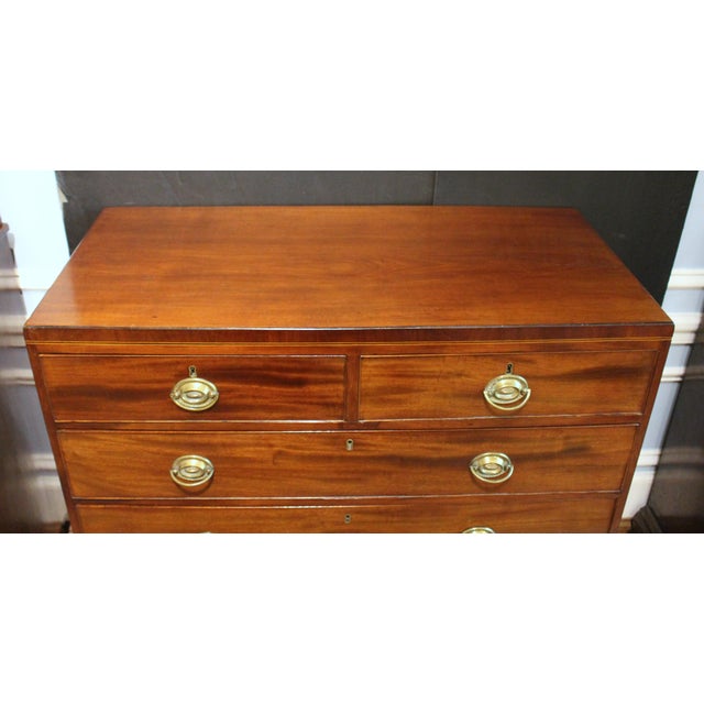 Circa 1780-1800 George III straight front chest of drawers, English. 2 short over 3 long, graduated drawers. Raised on...