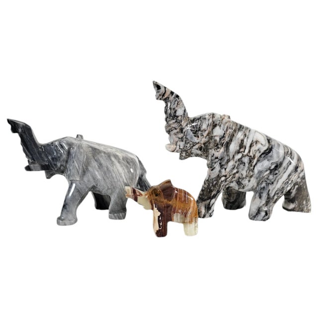 This is a set of three marble elephant figurines that are intricately detailed and made from hard marble. Each elephant...