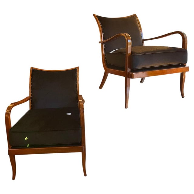 1940s Art Deco-style armchairs with sinuous lines, crafted in cherrywood. Restored and refinished, with newly padded...