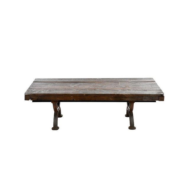 Coffee table in cast iron and wood. This piece is designed in the style of the selected designer and/or manufacturer