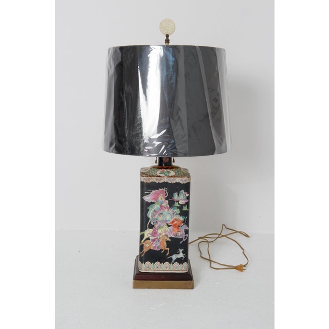 Good looking rectangular Asian black ceramic lamp. The background is black with beautiful scenic animals and figures in...