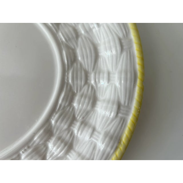 A charming decorative accent on your dining table, the white wicker ceramic dinner plate with yellow border adds a touch...