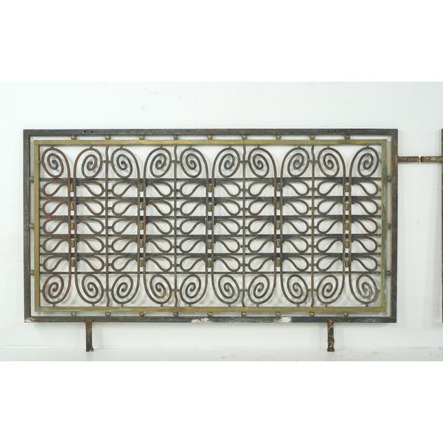 Vintage European Hollywood Regency architectural grills made of wrought iron and brass. These panels are designed as...
